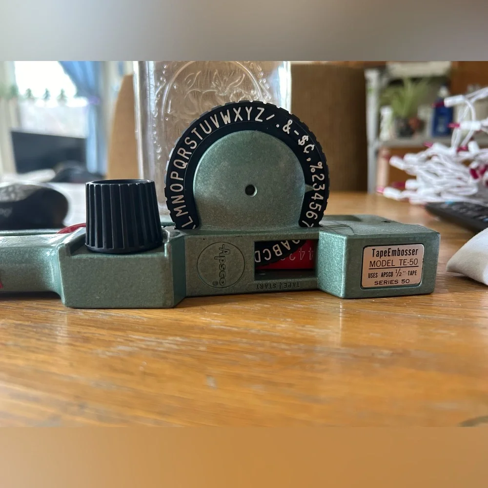 Apsco label maker with two rolls of red tape